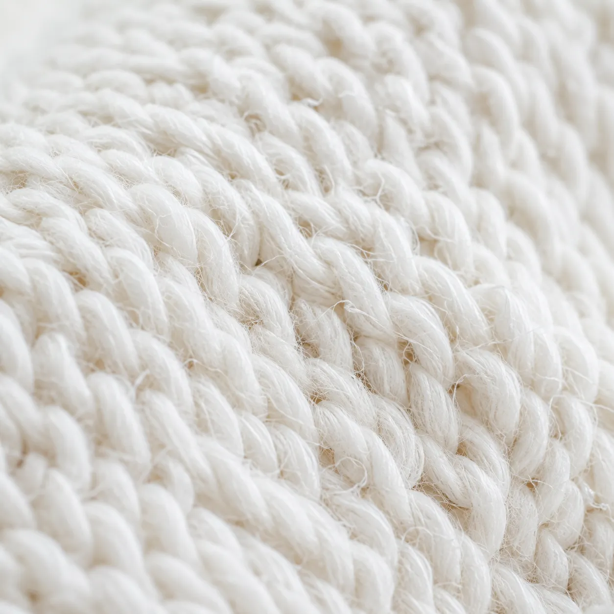 Extreme macro of undyed white cotton jersey.